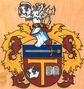 Tomáš Tichý: V červeném štítě s modrou hlavou s přirozeným mečem (špicí vpravo) zlatý antonínský kříž provázený vpravo stříbrnou zeměkouli glóbem s černými kontinenty a vlevo stříbrnou otevřenou knihou. Na kolčí přilbě s točenicí a přikryvadly červeno-zlatými rostoucí stříbrný dvouocasý lev držící v tlapách zeměkouli ze štítu.