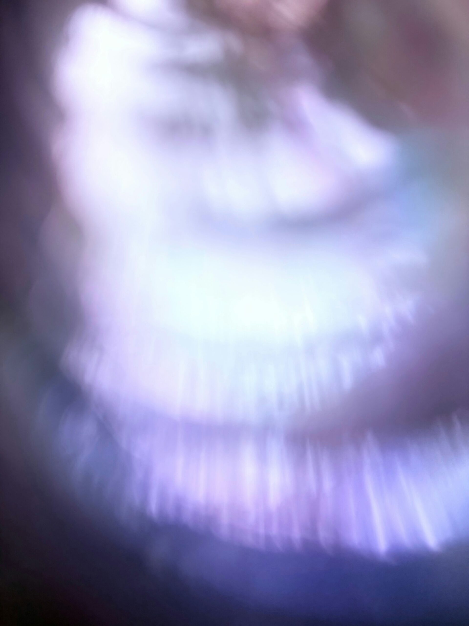 Abstract light streaks with purple and white hues